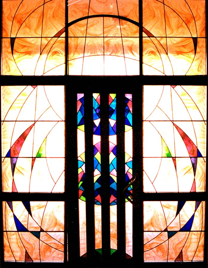 colourful large stained glass windows with light coming through