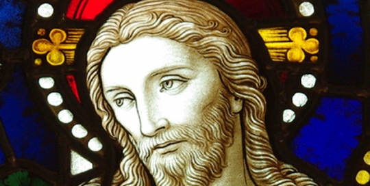 close up of jesus face in painted glass