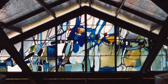 colourful stained glass triangular window