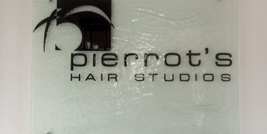 slumped glass business sign for pierrot's hair studio