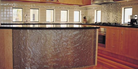 Slumped curved kitchen panel on island