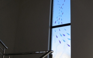 slumped glass window with laminated colour drops