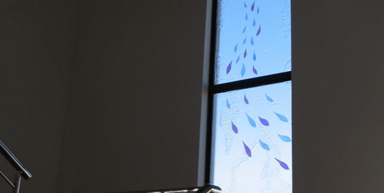 slumped glass window with laminated colour drops