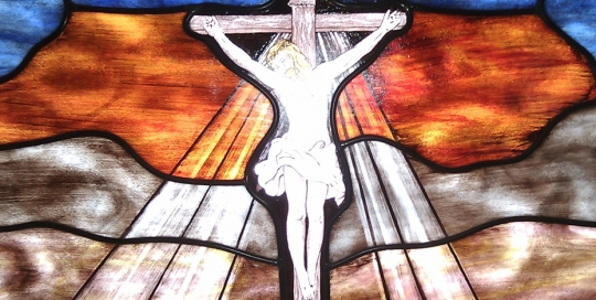 jesus on crucifix stained glass window