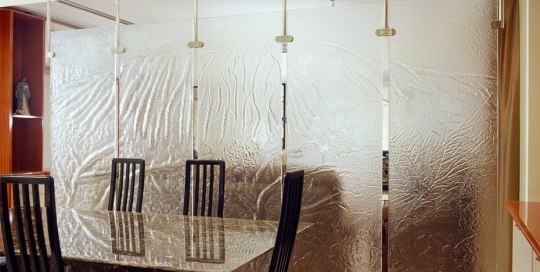 Decorative Glass dining room partition of slumped glass panels
