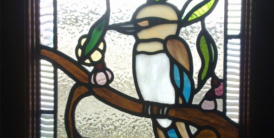 stained glass window with kookaburra