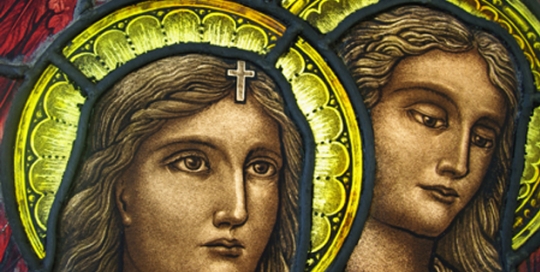 stained glass window with two figures with halos