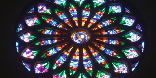 church rose stained glass window from below