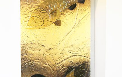 Decorative amber glass partition featuring fish