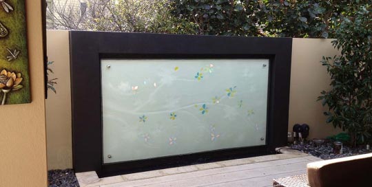 outdoor garden glass feature with flowers