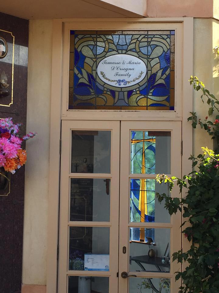 stained glass window with family plaque