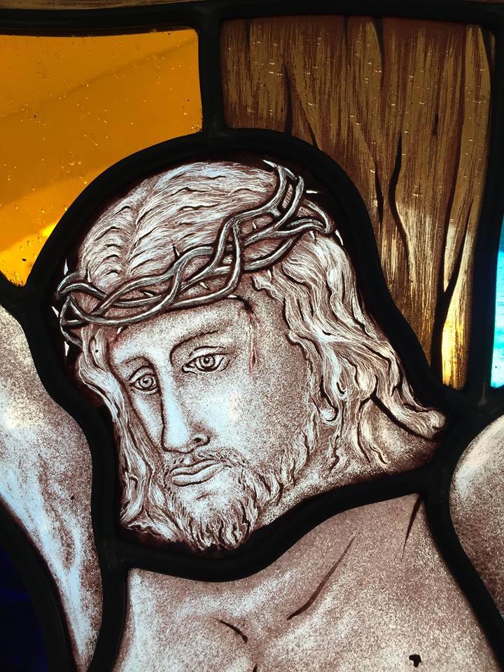 stained close up of stained glass with jesus in crown of thorns