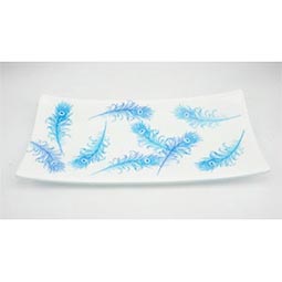 fused glass plate in white with blue peacock feathers