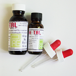large and medium bottle with hxtal labels and two eyedroppers