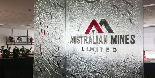 clear textured kiln formed with logo in laminated coloured glass signage