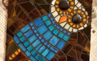 completed glass mosaic of owl