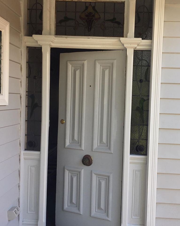 white door with five jacaranda stained glass panels in a federation house