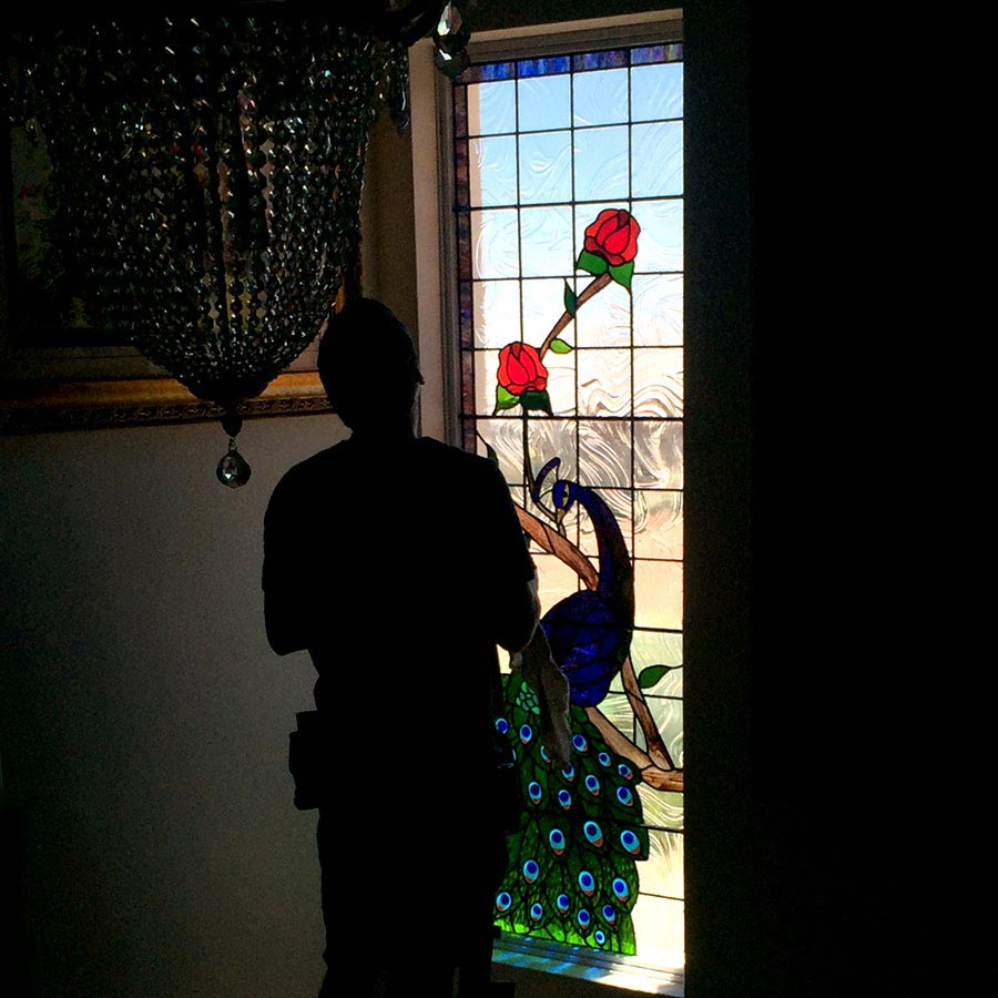 stained glass peacock stairwell window being installed by perth art glass