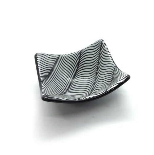 black and white geometric patterned glass plate swirls in stripes