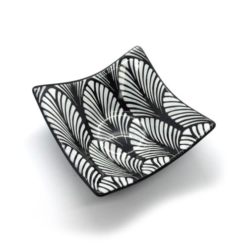 black and white geometric patterned glass plate leaves