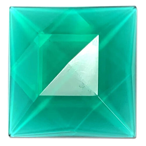 blue green cut glass jewel in the shape of a square