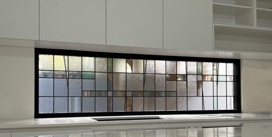 kitchen window in a contemporary industrial design made of stained glass