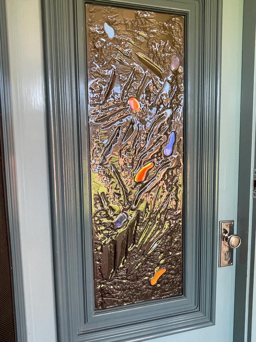 kiln formed glass door panel with laminated coloured pieces