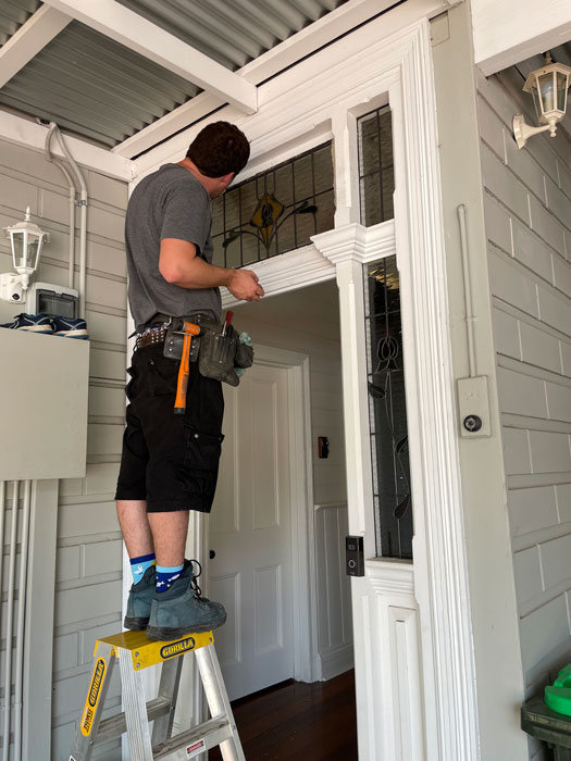 man installing windows in federation home