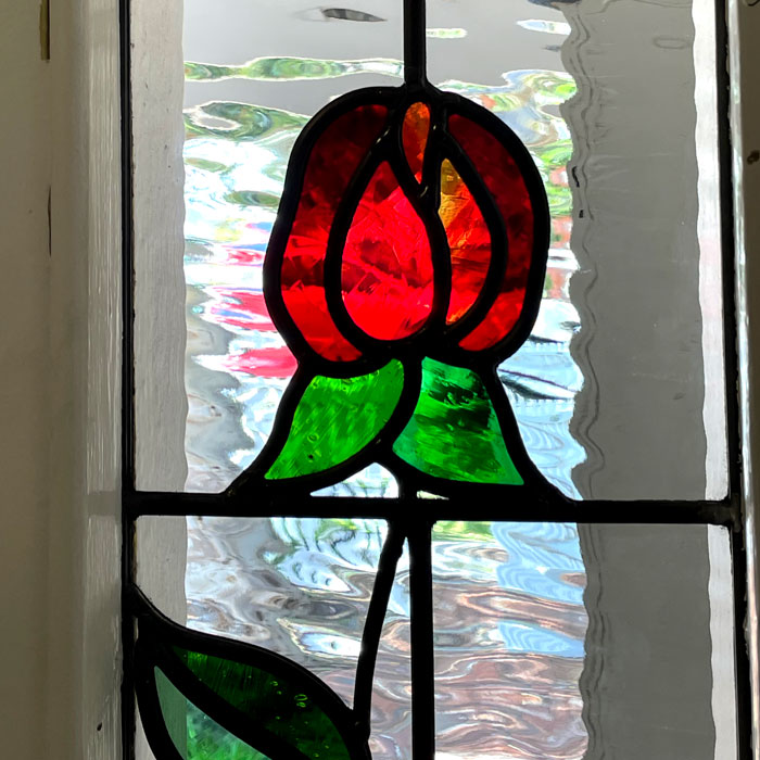 close up of stained glass red rose with clear texture background