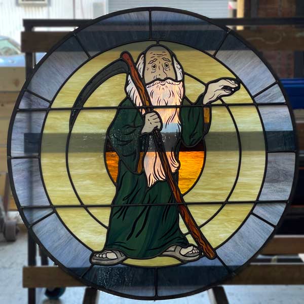 father time in round stained glass window