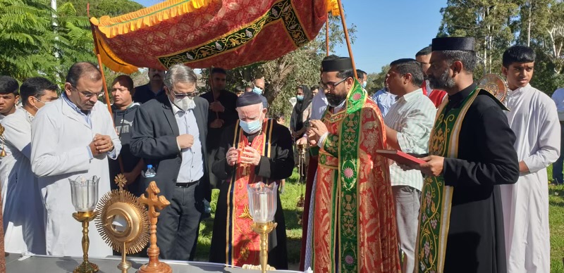 men in religious garb praying