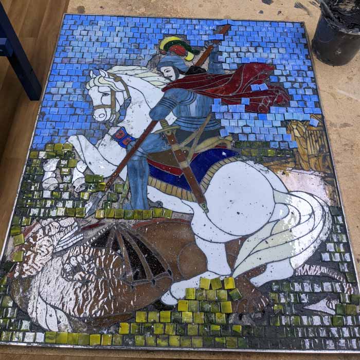 mosaic piece being grouted