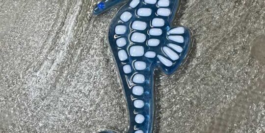blue glass seahorse with white spots