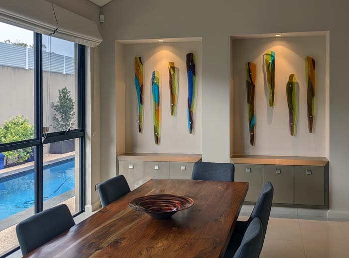 dining room with fused glass icicles as feature wall art