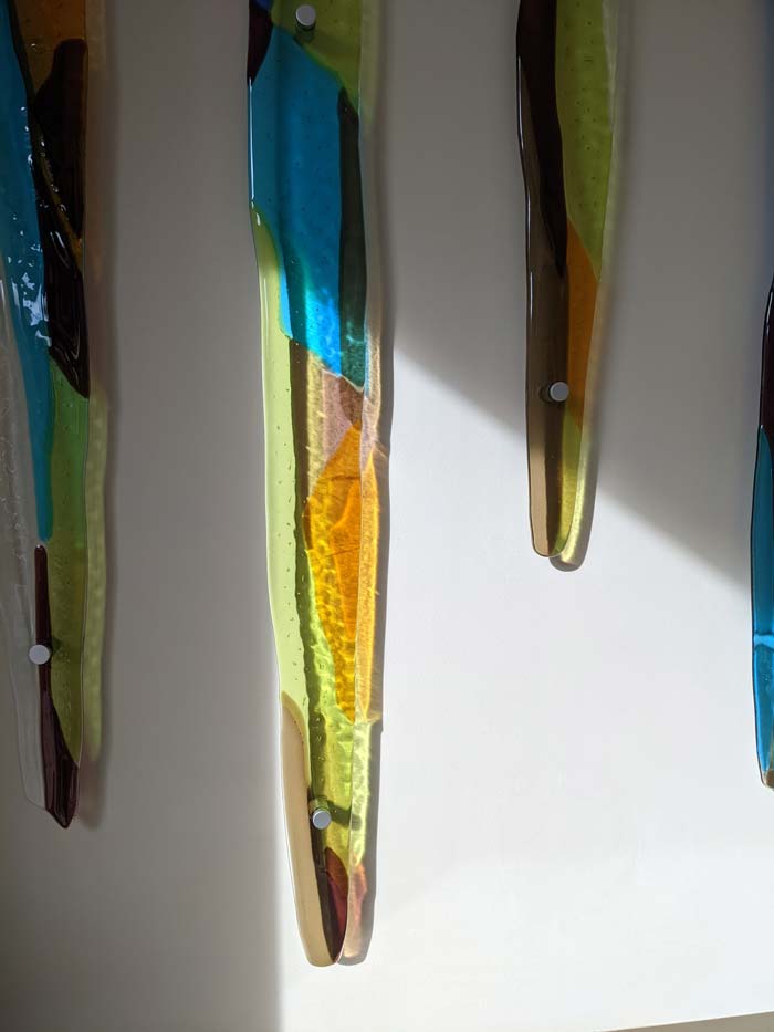 fused glass icicles attached to wall