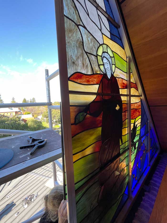 cross section of partially installed stained glass window