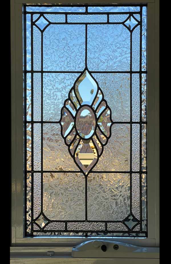 window with bevels and clear textured leadlight