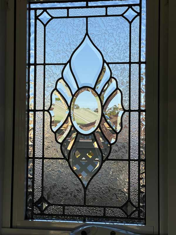 window with bevels and clear textured leadlight