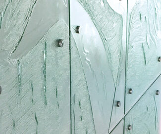 close up of whale tails in slumped glass panels