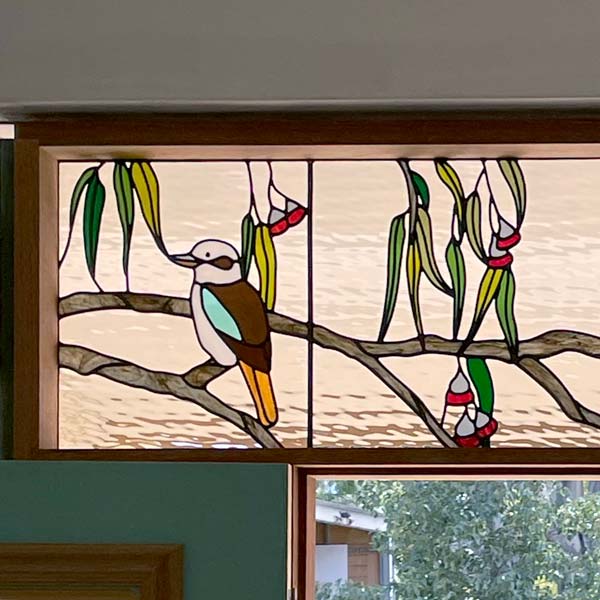 stained glass window in multiple panel with kookaburra and gum leaves