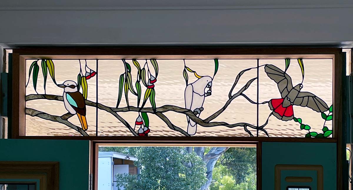 stained glass window in multiple panel with australian birds and flora